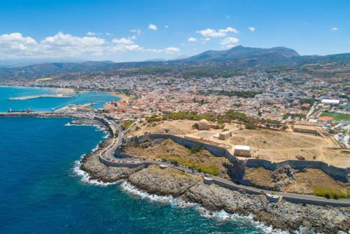an aerial view of a city next to the ocean at Villa Mary in Gerani
