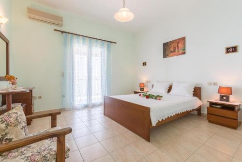 Ένα ή περισσότερα κρεβάτια σε δωμάτιο στο Villa Armandos