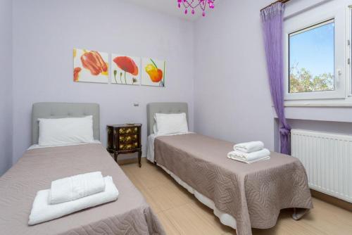 Letto o letti in una camera di Villa Thetis