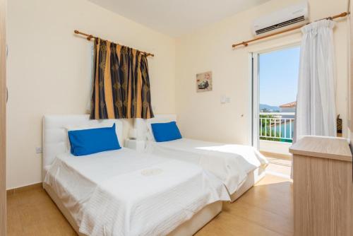 Ένα ή περισσότερα κρεβάτια σε δωμάτιο στο Kalisto Beach Villa