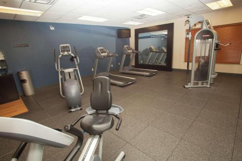 a gym with several treadmills and exercise bikes at Hampton Inn Elmira/Horseheads in Horseheads