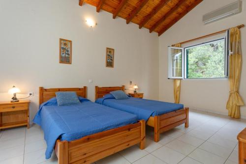 Postel nebo postele na pokoji v ubytování Villa Thalassa