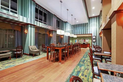 a dining room with a table and chairs at Hampton Inn & Suites El Paso West in El Paso