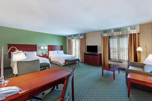 a hotel room with two beds and a desk at Hampton Inn & Suites El Paso West in El Paso