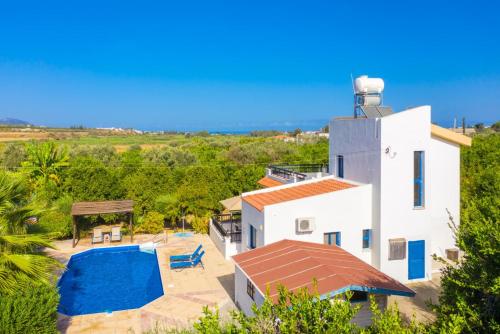 an aerial view of a house with a swimming pool at Villa Charoula Pente in Paphos