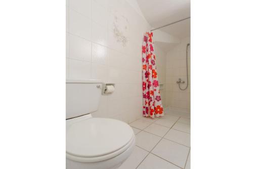 a bathroom with a toilet and a shower curtain at Villa Charoula Ena in Polis Chrysochous