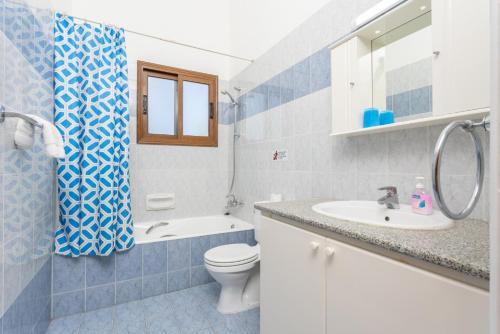 a bathroom with a toilet and a sink at Villa Halima Georgios in Polis Chrysochous
