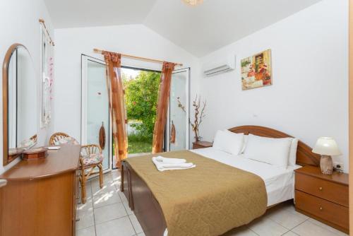 Кровать или кровати в номере Villa Melissa