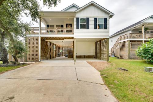 a large white house with a driveway at Kill Devil Hills Retreat with Gas Grill and Deck! in Kill Devil Hills