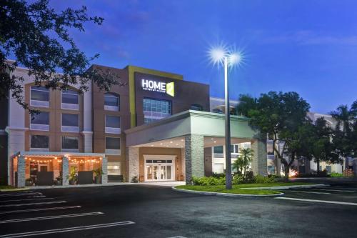 a hotel front of a building with a parking lot at Home2 Suites by Hilton Miramar Ft. Lauderdale in Miramar