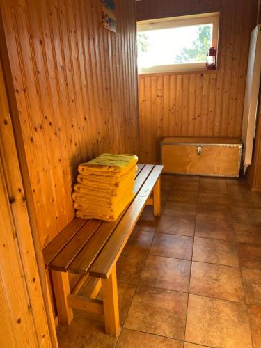 a room with a wooden bench in a sauna at Rannakivi Puhkemaja in Kärdla