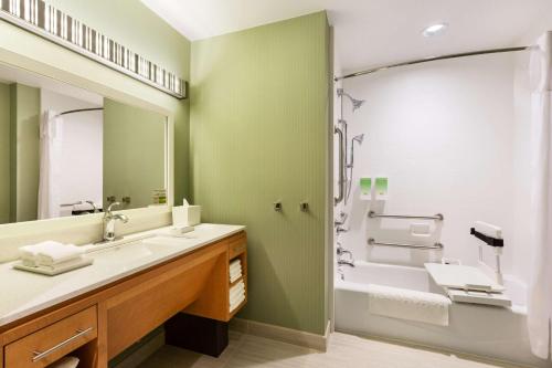 a bathroom with a large sink and a shower at Home2 Suites by Hilton Sioux Falls Sanford Medical Center in Sioux Falls