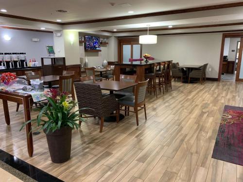 a dining room with wooden tables and chairs at Hampton Inn Fort Stockton in Fort Stockton