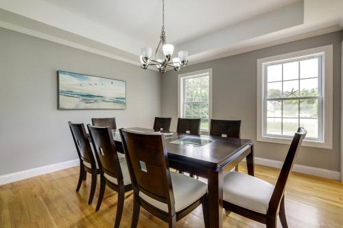 a dining room with a table and chairs at Coastal Retreat at Mystic Seaport Heights in Mystic