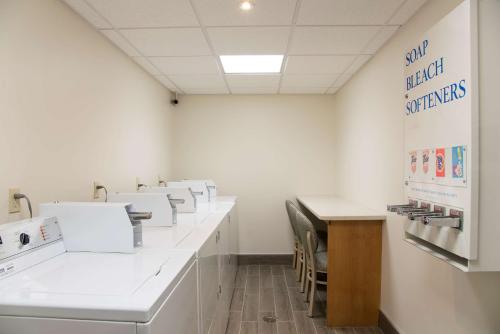 a laboratory with a row of white counters and tables at Hampton Inn Grand Rapids-South in Wyoming