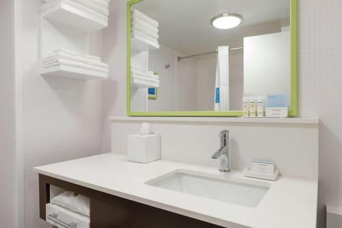 a bathroom with a sink and a mirror at Hampton Inn Greenville-Simpsonville in Simpsonville