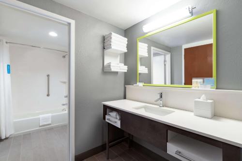 a bathroom with a sink and a mirror at Hampton Inn Greenville-Simpsonville in Simpsonville