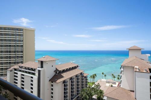 a view of the ocean from the balcony of a resort at Embassy Suites by Hilton Waikiki Beach Walk in Honolulu
