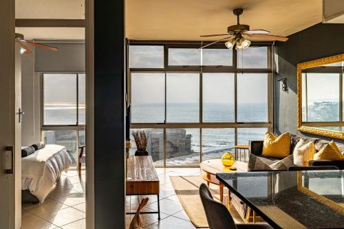 a living room with a view of the ocean at Cosy Sky View Apartment in Ballito