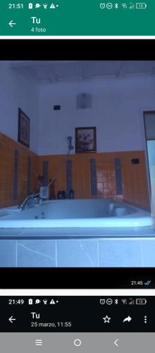 a view of a bathroom with a bath tub at Villa Amaranta Room and Breakfast in Edolo