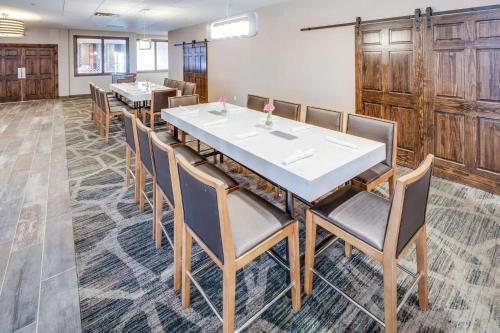 a dining room with a long table and chairs at DoubleTree by Hilton Huntington, WV in Huntington