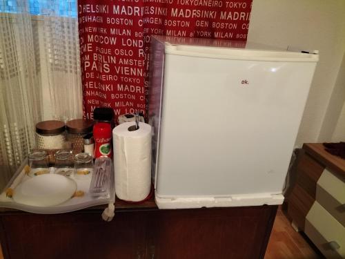 a refrigerator freezer sitting on top of a counter at Acogedora Habitación en Madrid in Madrid
