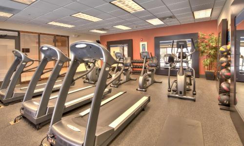 a gym with treadmills and elliptical machines at Hampton Inn Wilmington University Area in Wilmington