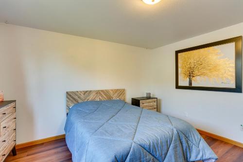 a bedroom with a bed and a picture on the wall at Seaside Eureka Vacation Rental with Bay Views! in Eureka