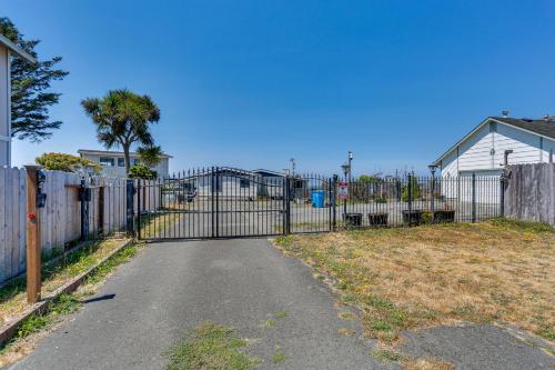 an iron gate in a yard with a fence at Seaside Eureka Vacation Rental with Bay Views! in Eureka