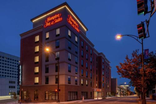 a building with a sign on the side of it at Hampton Inn & Suites Winston-Salem Downtown in Winston-Salem