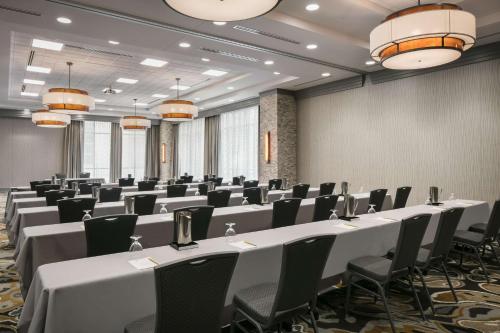 a conference room with rows of tables and chairs at Hilton Garden Inn Iowa City Downtown University in Iowa City