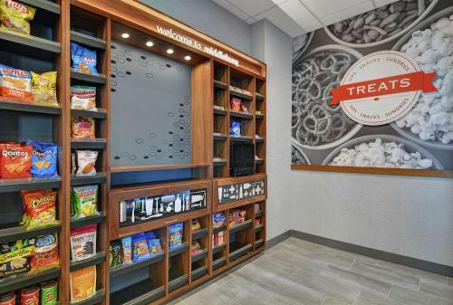 a treats section of a grocery store aisle with food at Hampton Inn & Suites Middleburg, Fl in Middleburg