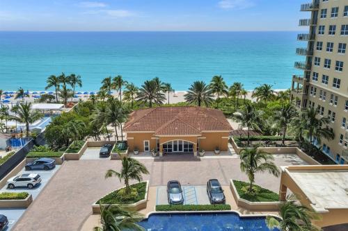 an aerial view of a resort with the ocean in the background at Gorgeous Townhouse Beach Access Resort Amenities in Hallandale Beach