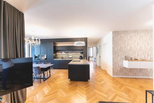 a large kitchen and dining room with a dining table at TIP! Design trifft Lage 120 qm Premium Apartment in Dresden