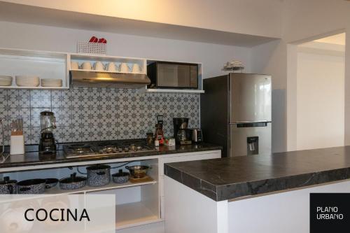 a kitchen with a refrigerator and a counter top at Apartamento nuevo en Veracruz Centro in Veracruz