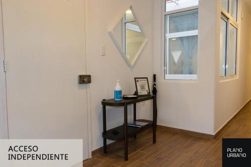 a room with a table and a mirror on the wall at Apartamento nuevo en Veracruz Centro in Veracruz