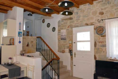 a room with a staircase and a white door at Aretousa Residence in Naoussa, Paros in Naousa