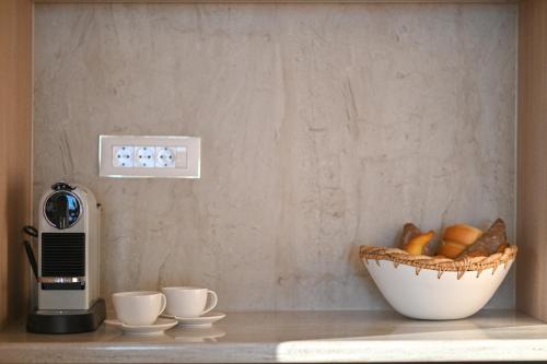 a kitchen counter with a bowl of bread and aresso at Villa Rosemary East in Makarska