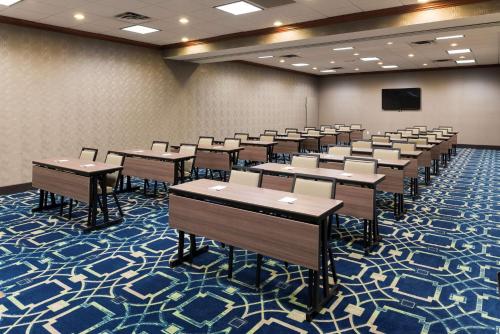 a classroom with tables and chairs in a room at Hampton Inn & Suites East Lansing in Okemos