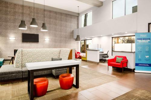 a living room with a couch and a table at Hampton Inn & Suites Las Vegas-Henderson in Las Vegas