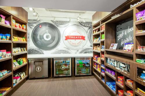 a store aisle with a large poster on the wall at Hampton Inn & Suites Las Vegas-Henderson in Las Vegas