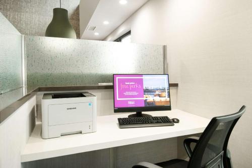 a desk with a computer and a printer on it at Hampton Inn & Suites Las Vegas-Henderson in Las Vegas