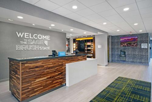 a welcome to the sauce busse bussebucks counter in a lobby at Hampton Inn Las Vegas Strip South, NV 89123 in Las Vegas
