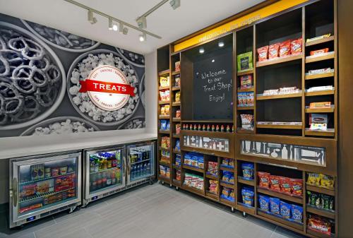 a store aisle with food items on the wall at Hampton Inn Las Vegas Strip South, NV 89123 in Las Vegas