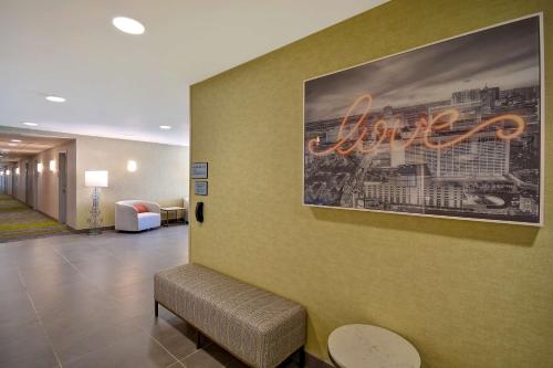a lobby of a hospital with a painting on the wall at Home2 Suites by Hilton Las Vegas Convention Center - No Resort Fee in Las Vegas