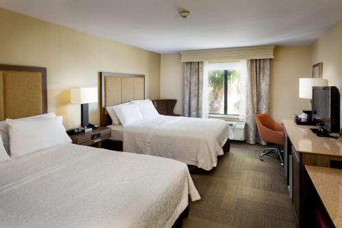 a hotel room with two beds and a window at Hampton Inn & Suites Las Vegas-Red Rock/Summerlin in Las Vegas