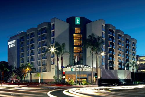 a hotel building at night with a street at Embassy Suites Los Angeles - International Airport/North in Los Angeles