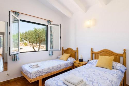 En eller flere senge i et værelse på Eulalia Uno