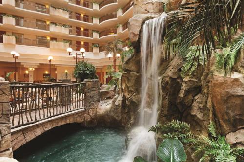 a waterfall in the lobby of a hotel at Embassy Suites by Hilton Anaheim South in Anaheim