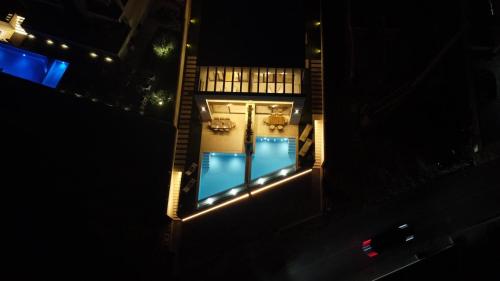 an overhead view of a swimming pool at night at Villa Rosemary in Makarska